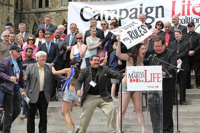 Topless protesters disrupt anti-abortion rally | Ontario 